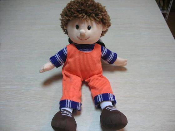 stuffed boy doll
