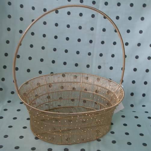 Hand Woven Metal Wire Basket With Long Handle And In Gold Or Silver Hand Woven Metal Wire Basket With Long Handle And In Gold Or Silver Image
